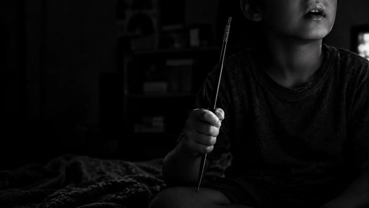 ① Sticks in a nine-year-old's hands
