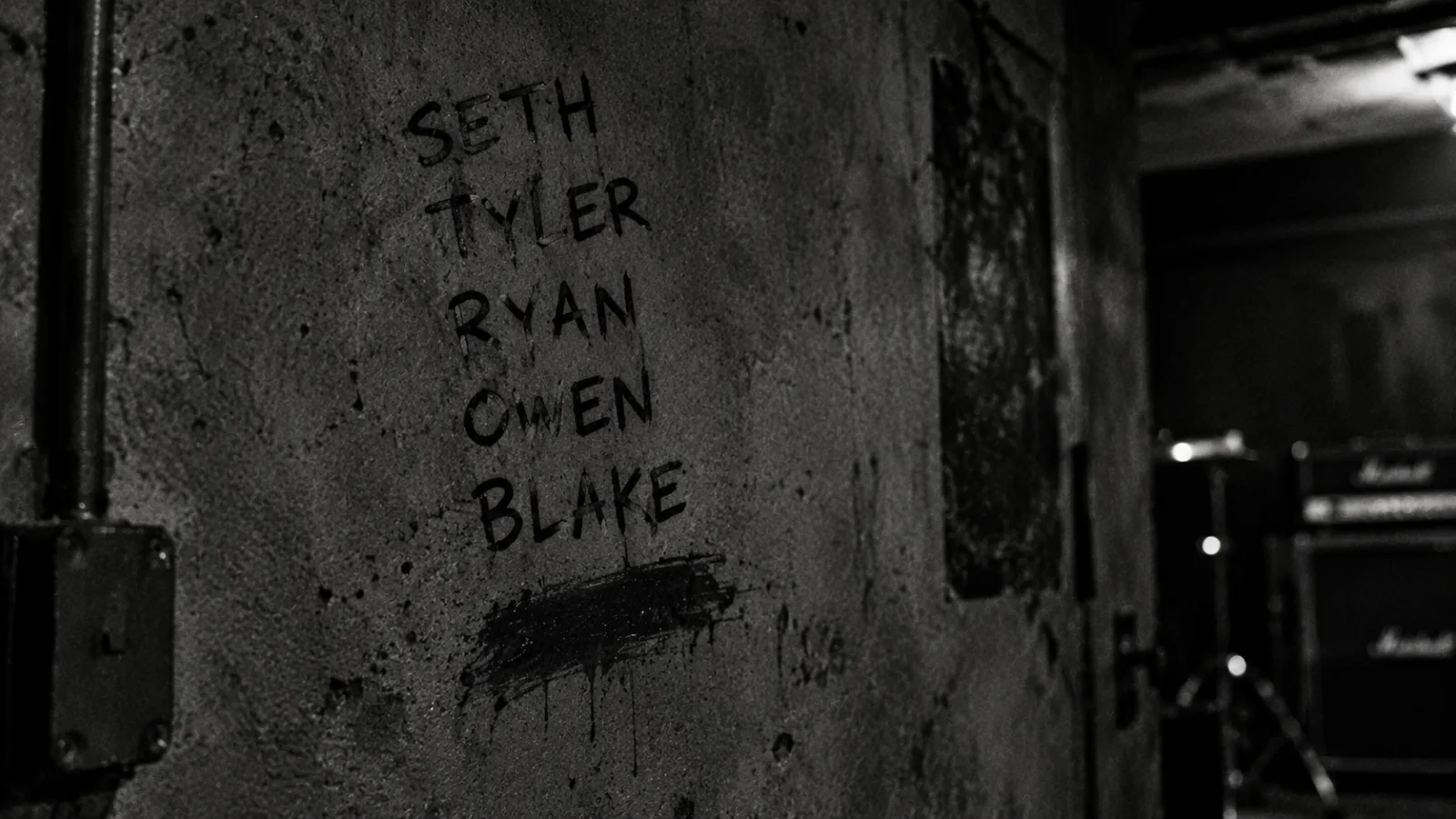 Five names on the wall, and a sixth erased